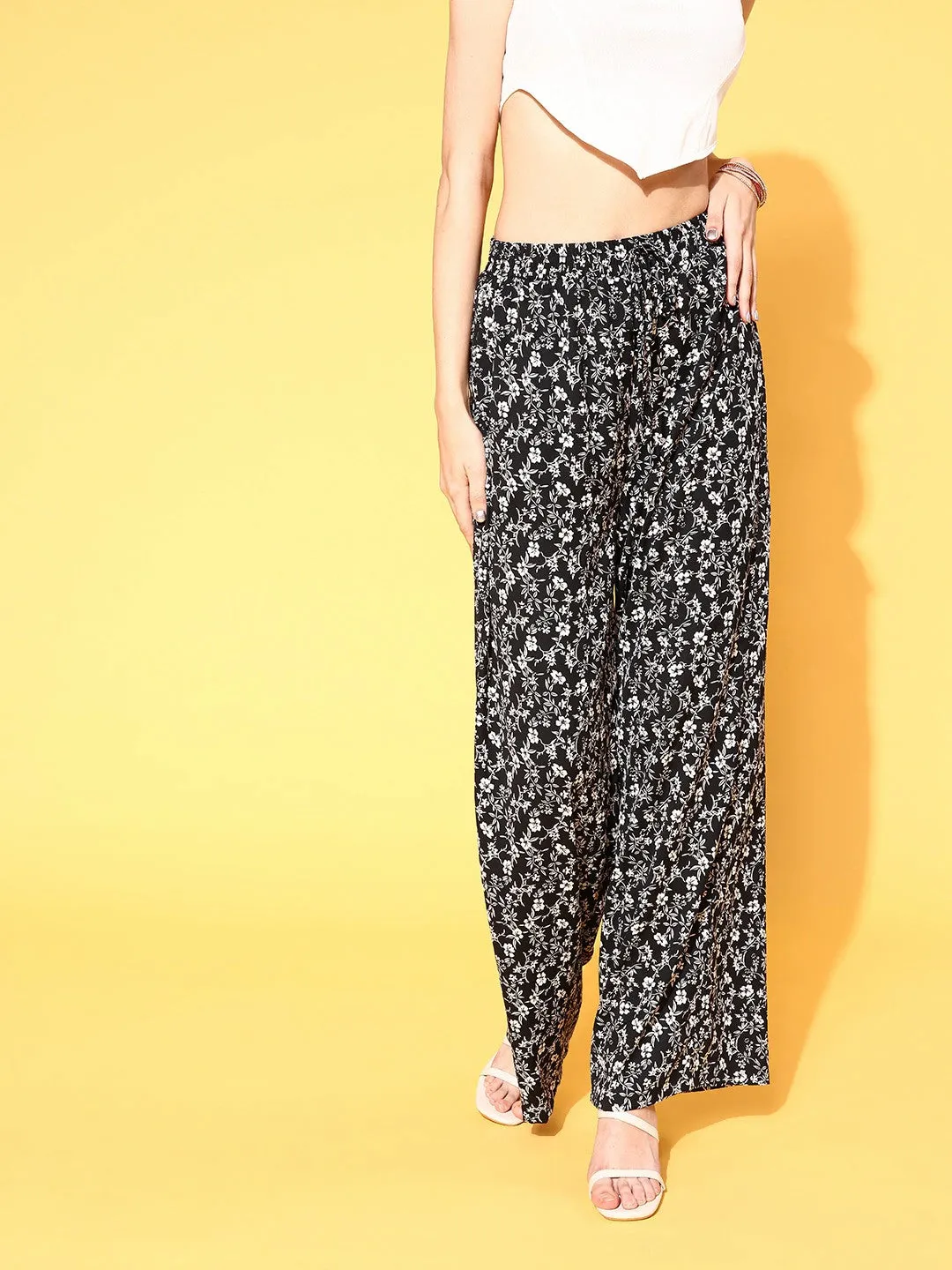 Berrylush Women Black & White Floral Printed High-Rise Waist Wide Leg Flared Trousers